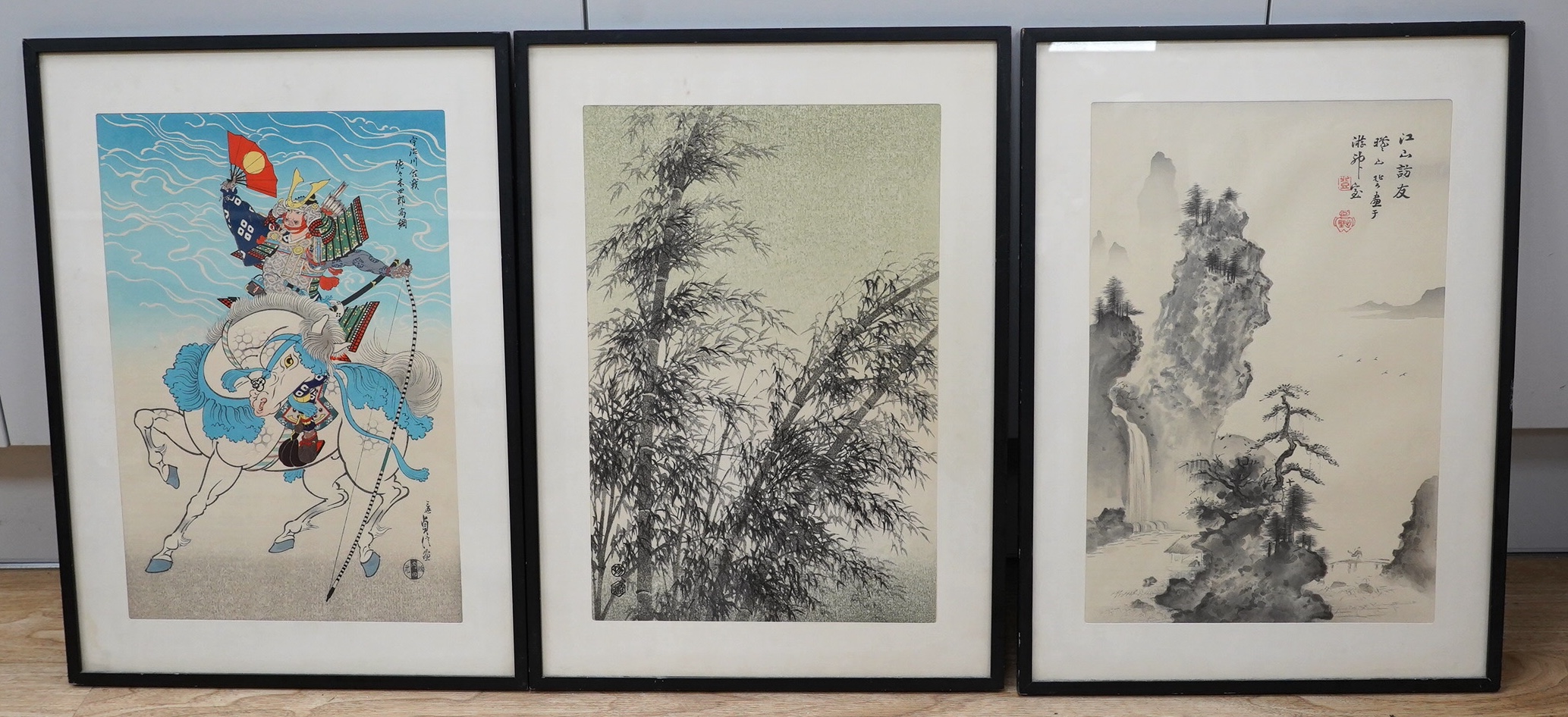 Three Japanese woodblock prints including one after Hasegawa Sadanobu III (1881-1963), 'Horse Warrior' and after Gizan Izuno (1885-1957), 'Nanga', overall 48 x 33cm. Condition - fair to good